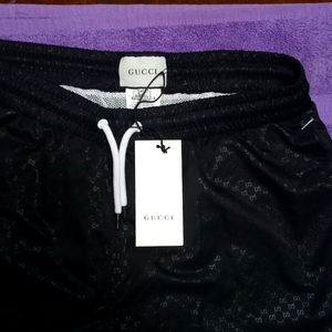 Selling a brand new pair of Gucci swim shorts.
